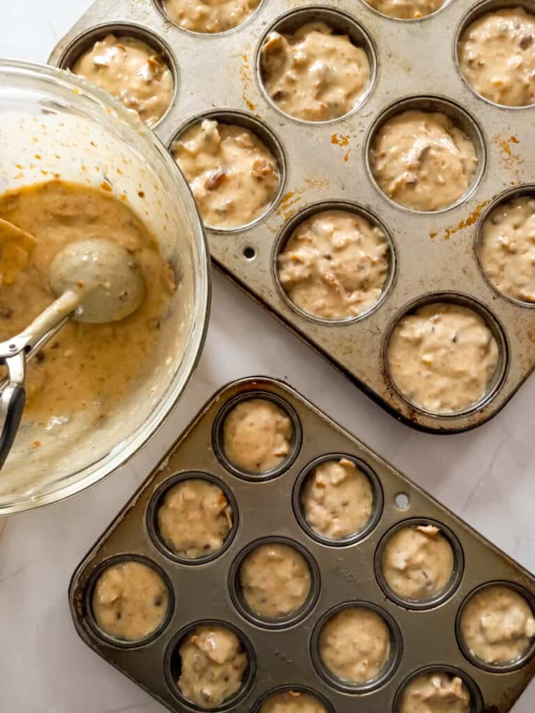 filling muffin tins with buttermilk bran batter.