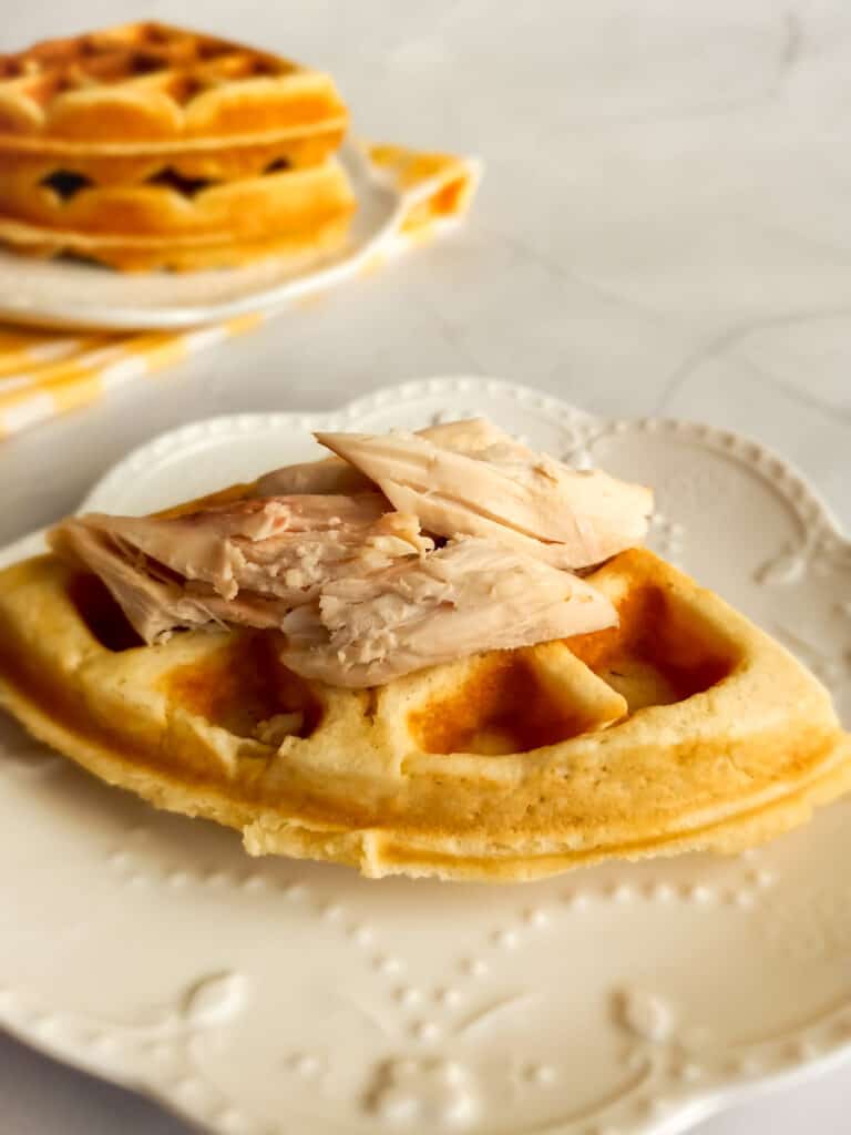 a few pieces of chicken on a waffle.