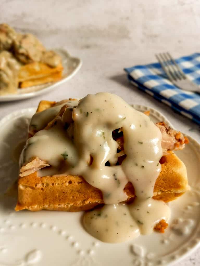 chicken and gravy over a waffle.