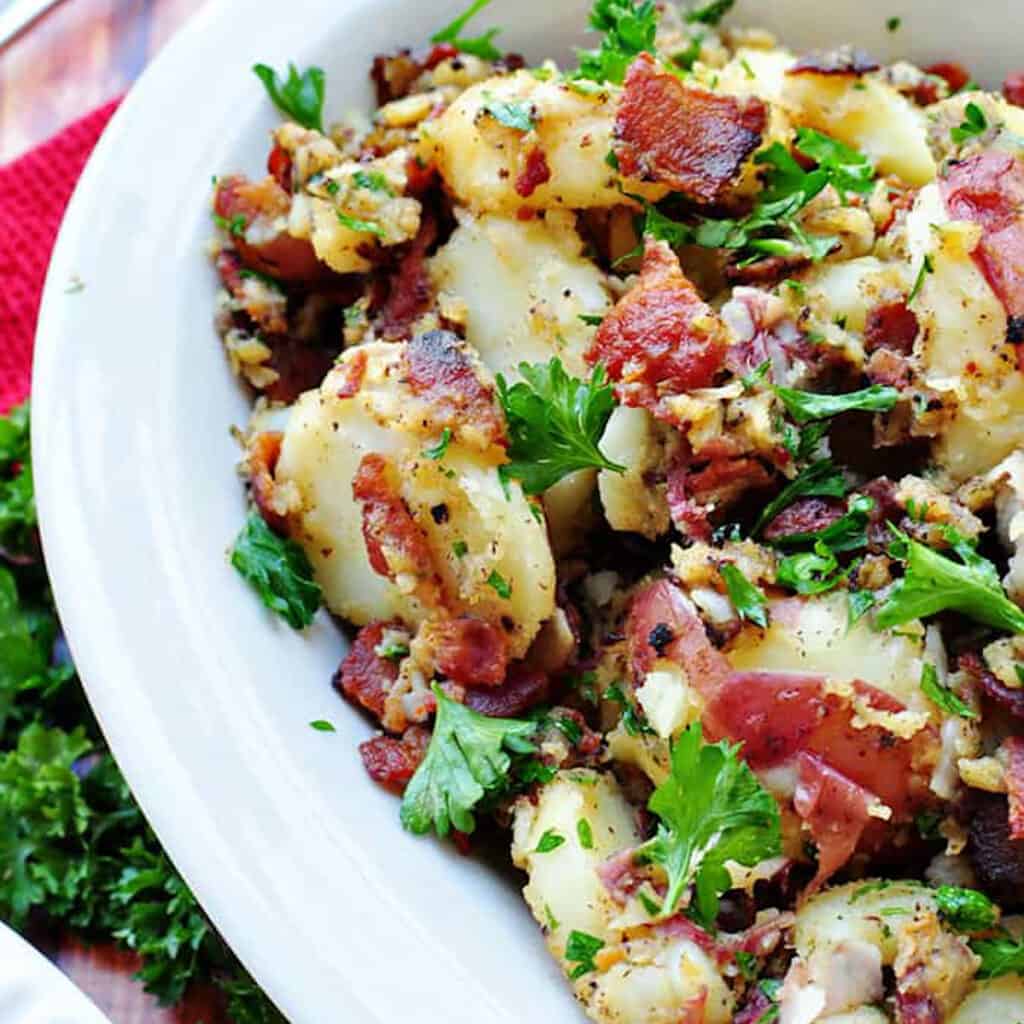 a bowl of warm German potato salad to serve as a side for burgers.