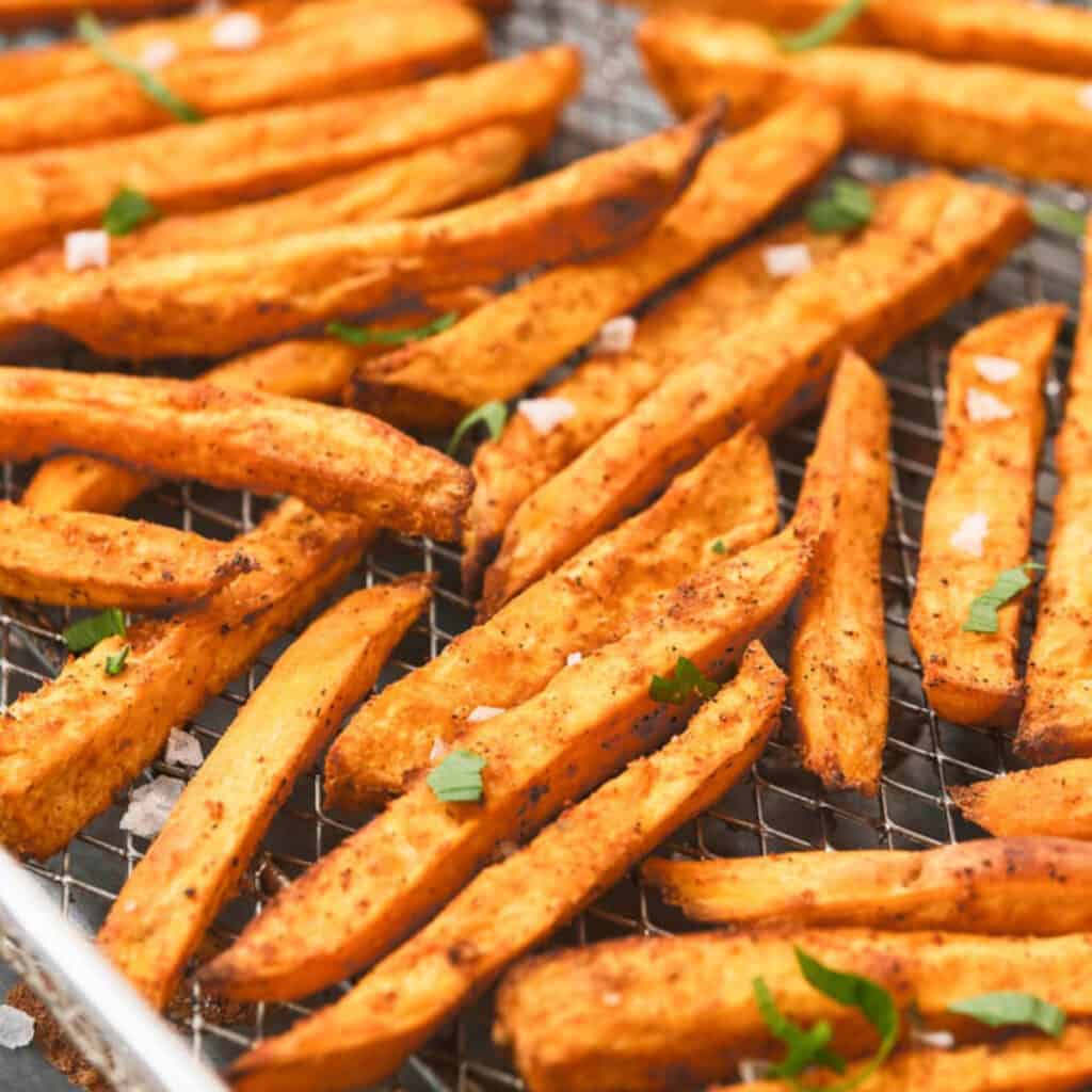 sweet potato fries in a fryer basket.