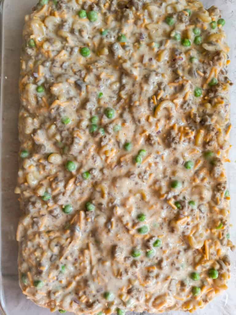 Amish meat and pasta casserole in a 9x13" baking dish all ready to bake.