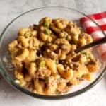 ready to enjoy a bowl of easy Amish macaroni and ground beef casserole with peas.