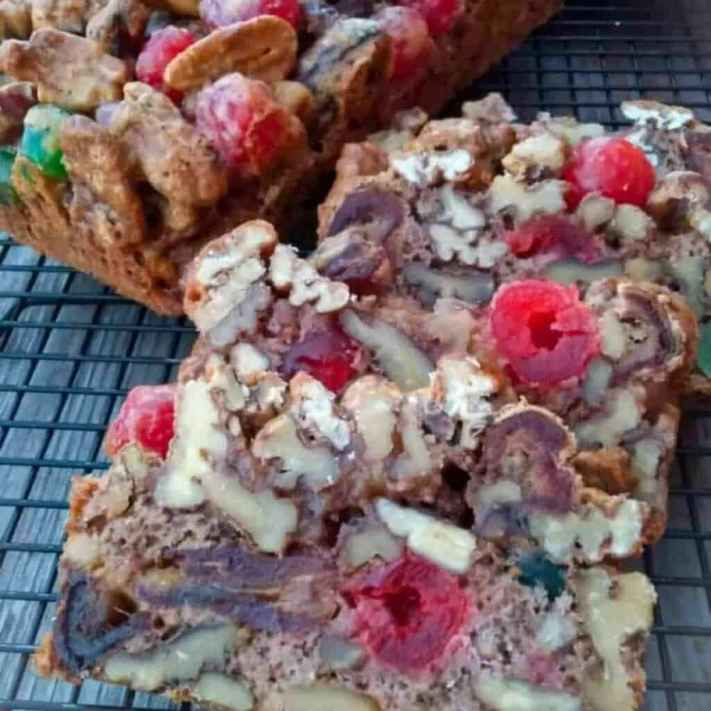 Amish fruit cake slices showcasing all the nuts and fruit on the inside.