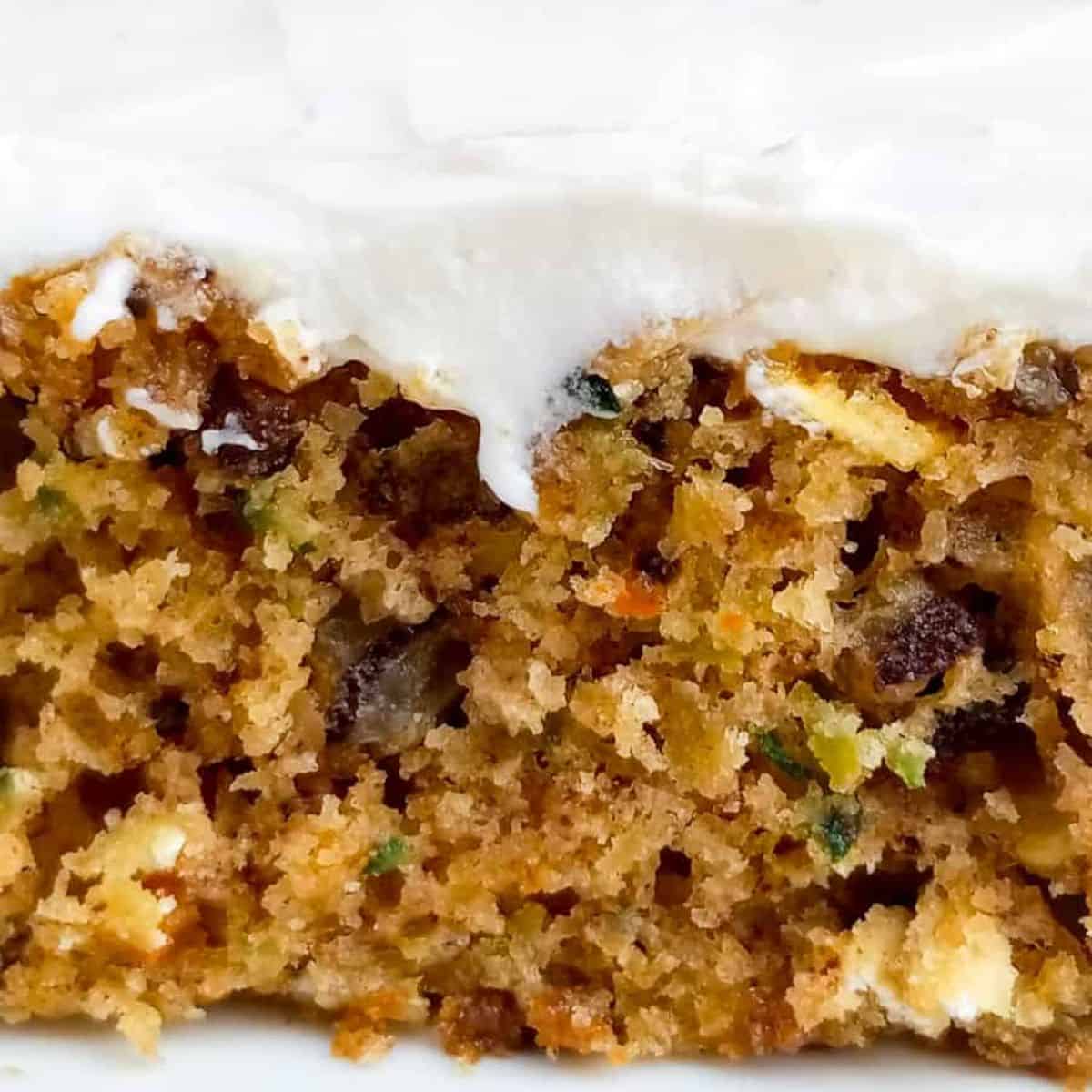 close up of a zucchini bar with frosting.