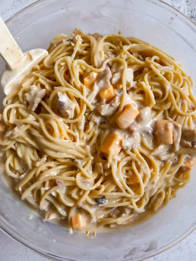 chicken and spaghetti casserole mixed in a big bowl.