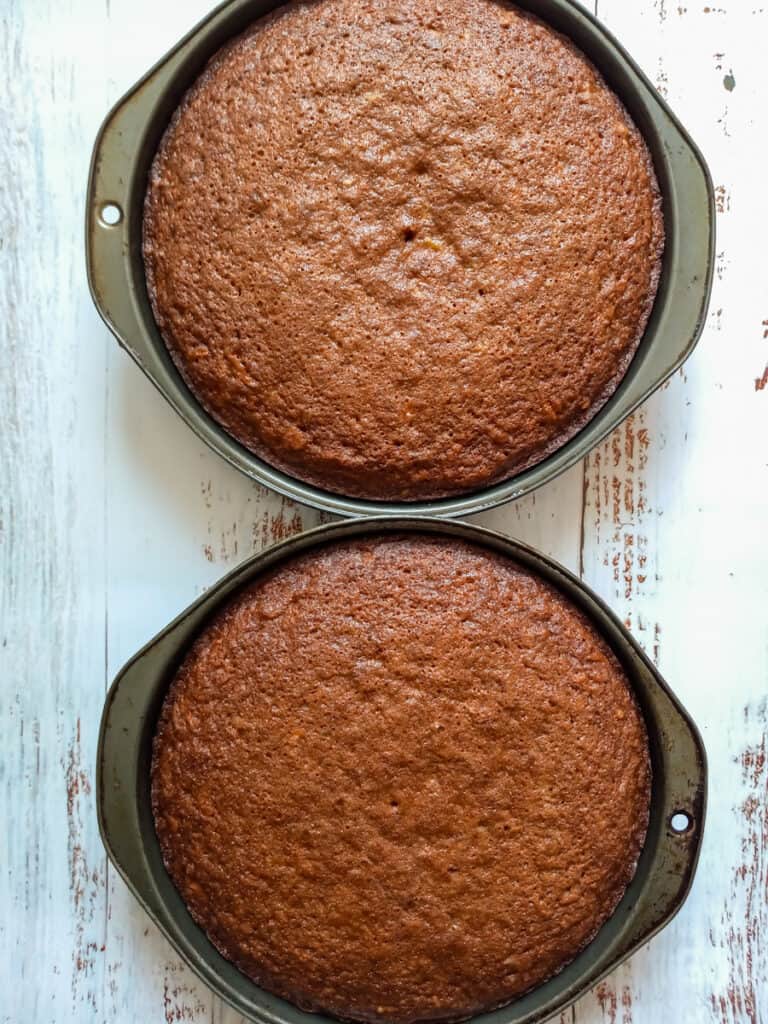 two round baked carrot cakes.