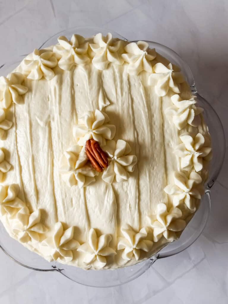 carrot cake covered in cream cheese frosting.
