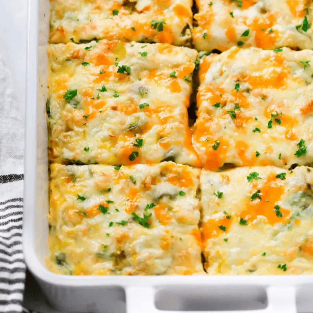 cheesy breakfast casserole in a pan and cut into slices.