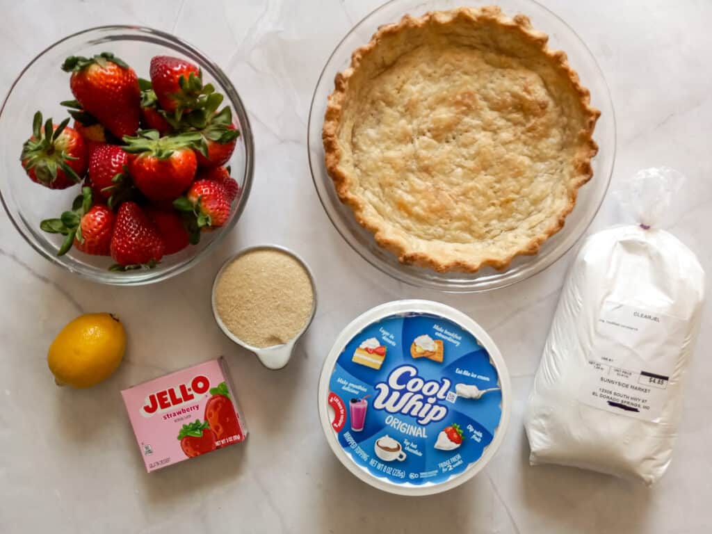 Ingredients: pie crust, strawberries, jello, sugar, clear jel, lemon juice, and Cool Whip.