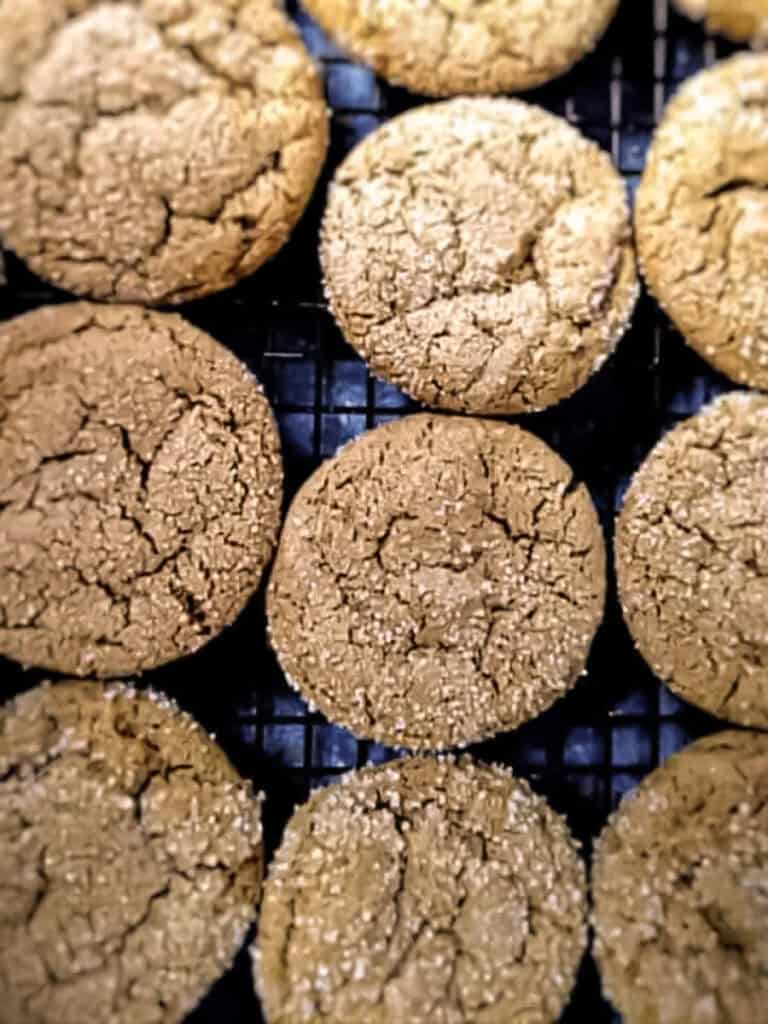 gingersnap cookies on a wire cooling rack.