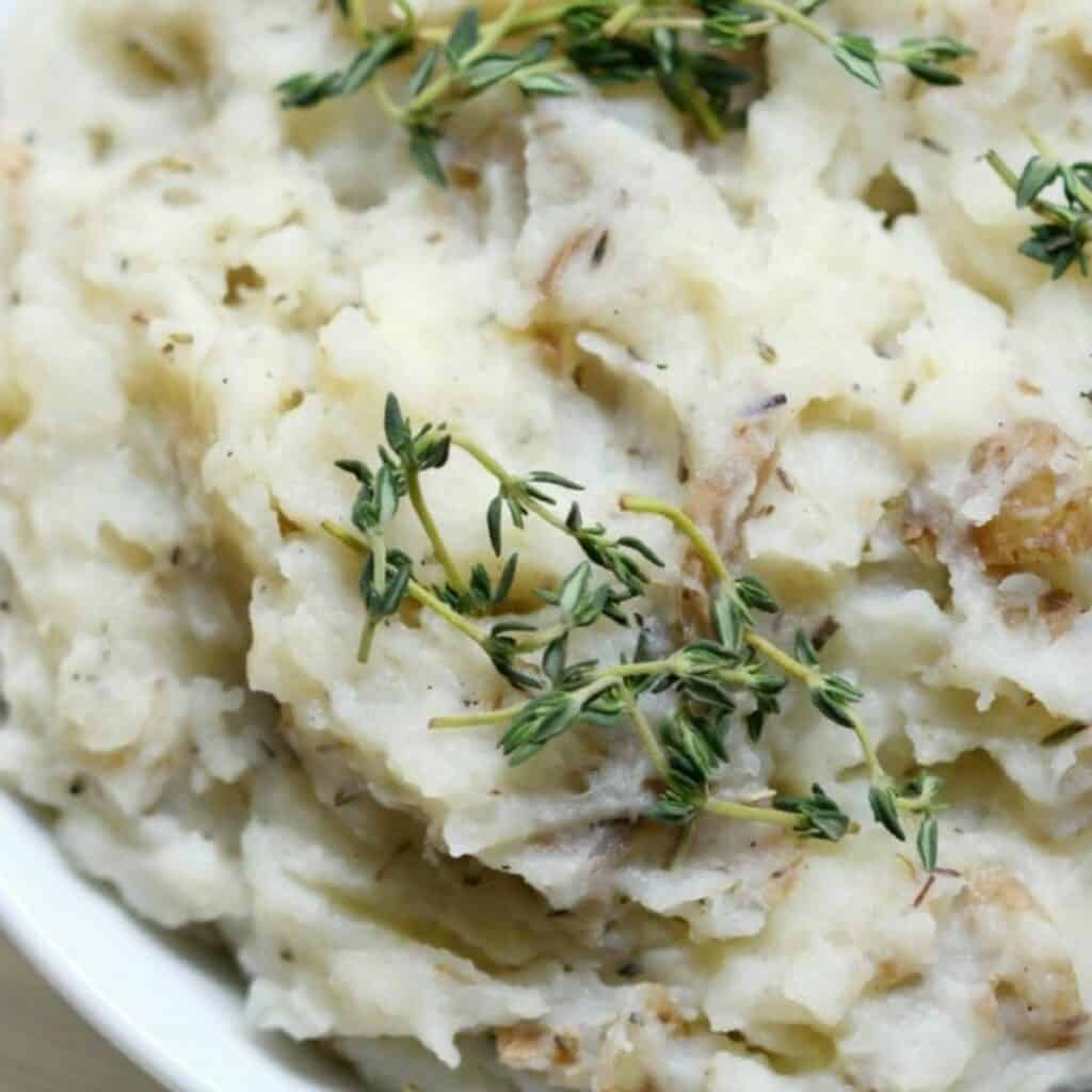 a bowl of rosemary and thyme mashed potatoes.