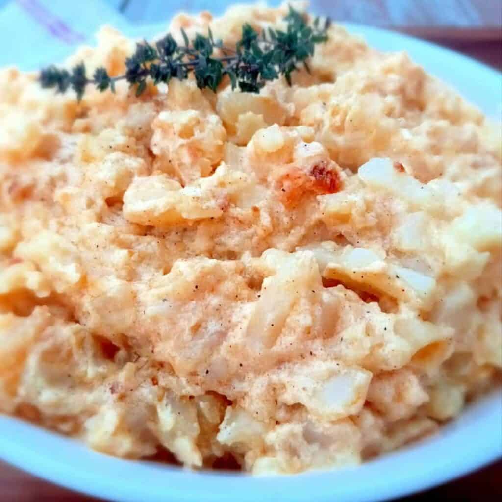 a bowl of scalloped potatoes to serve with bbq meatballs.