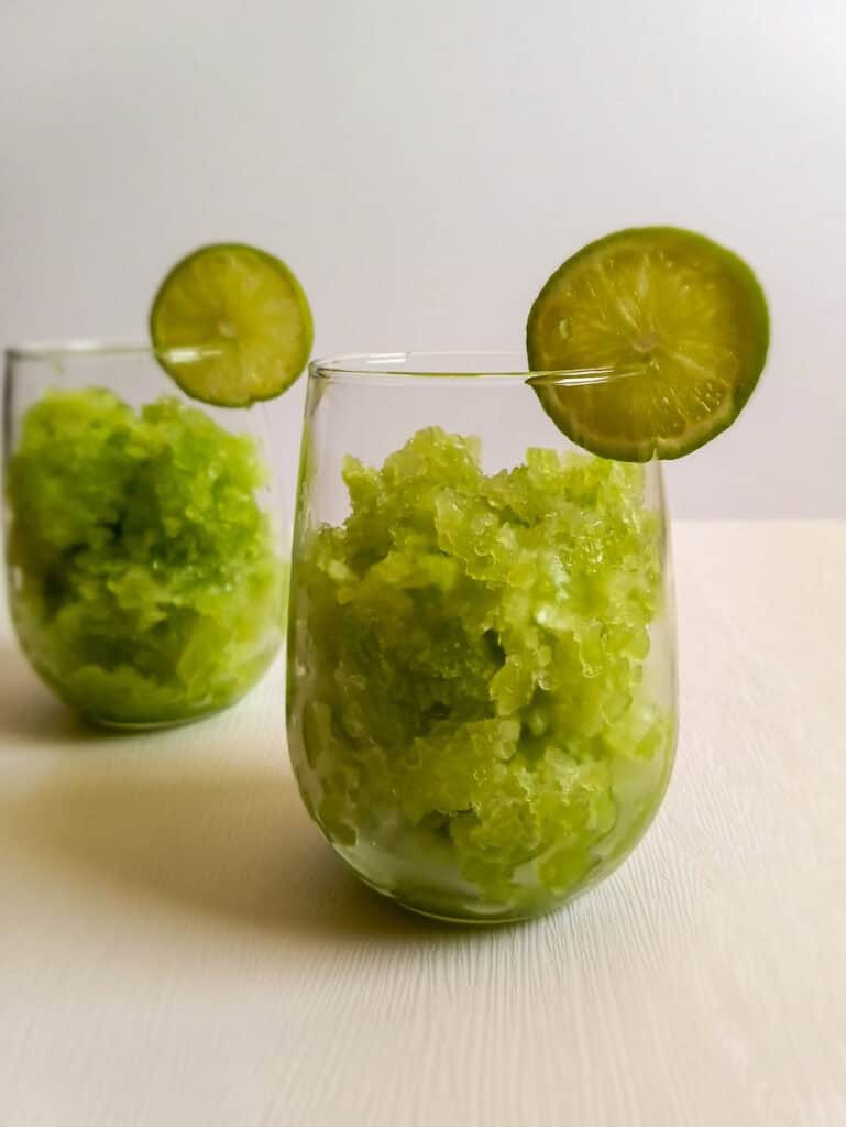 two cups with chopped lime slush.