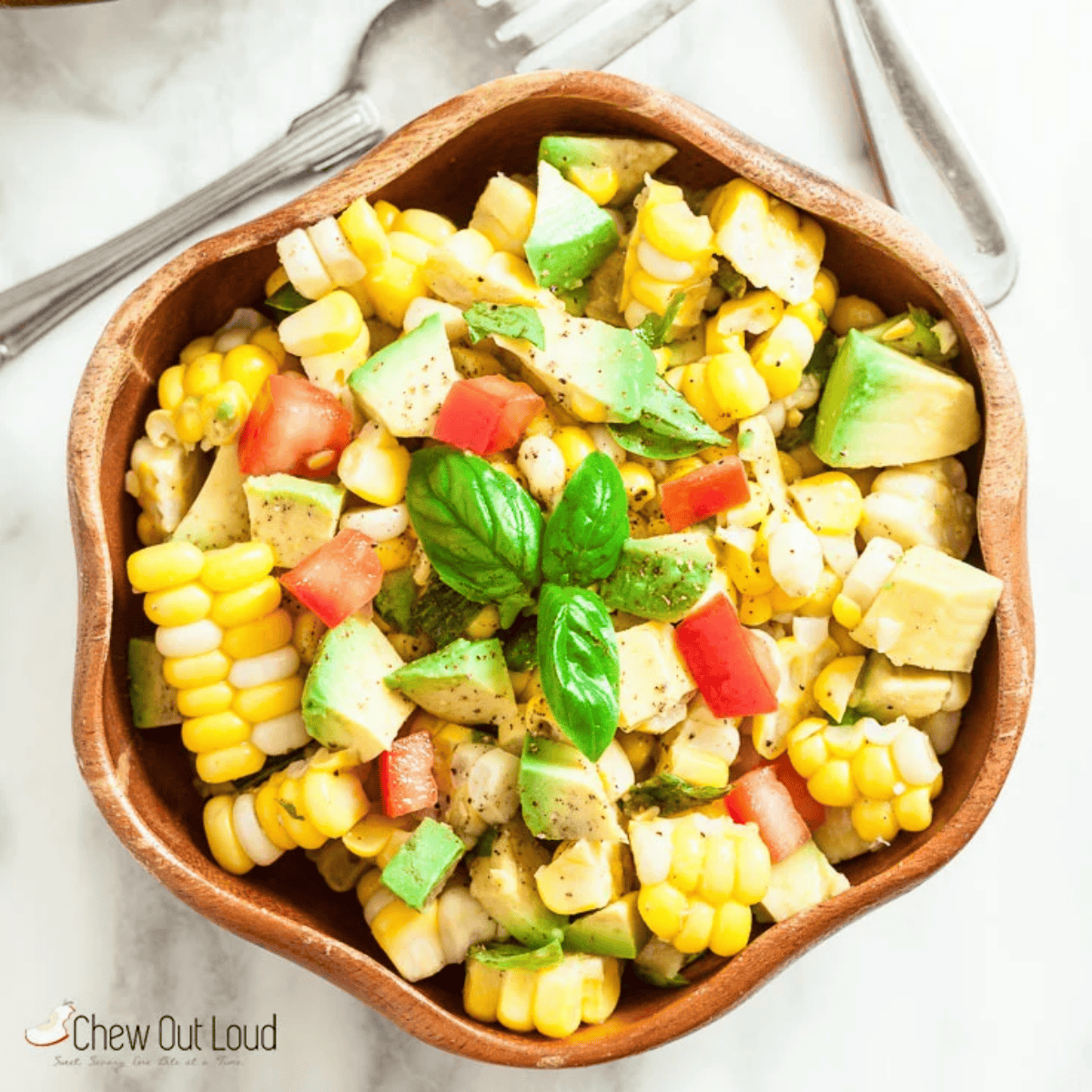 a bowl of fresh corn avocado salad.
