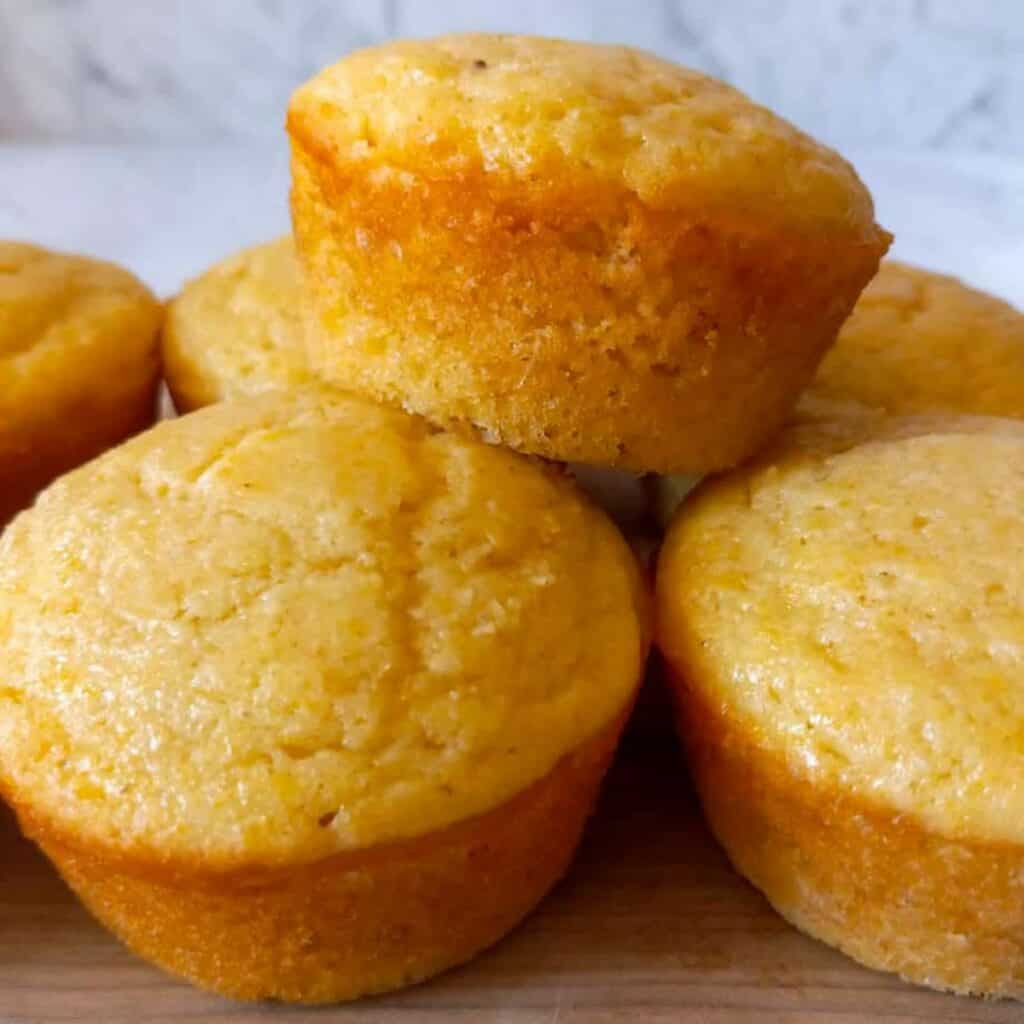 a stack of cornbread muffins.