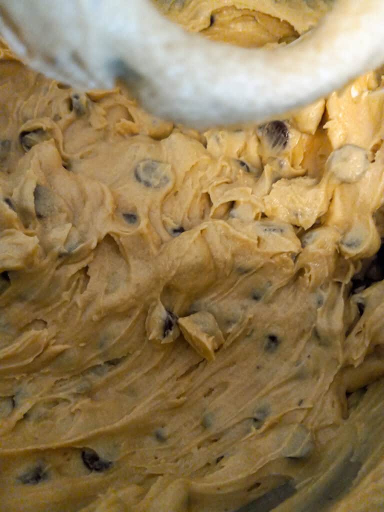 mixed cookie batter in a large mixing bowl.