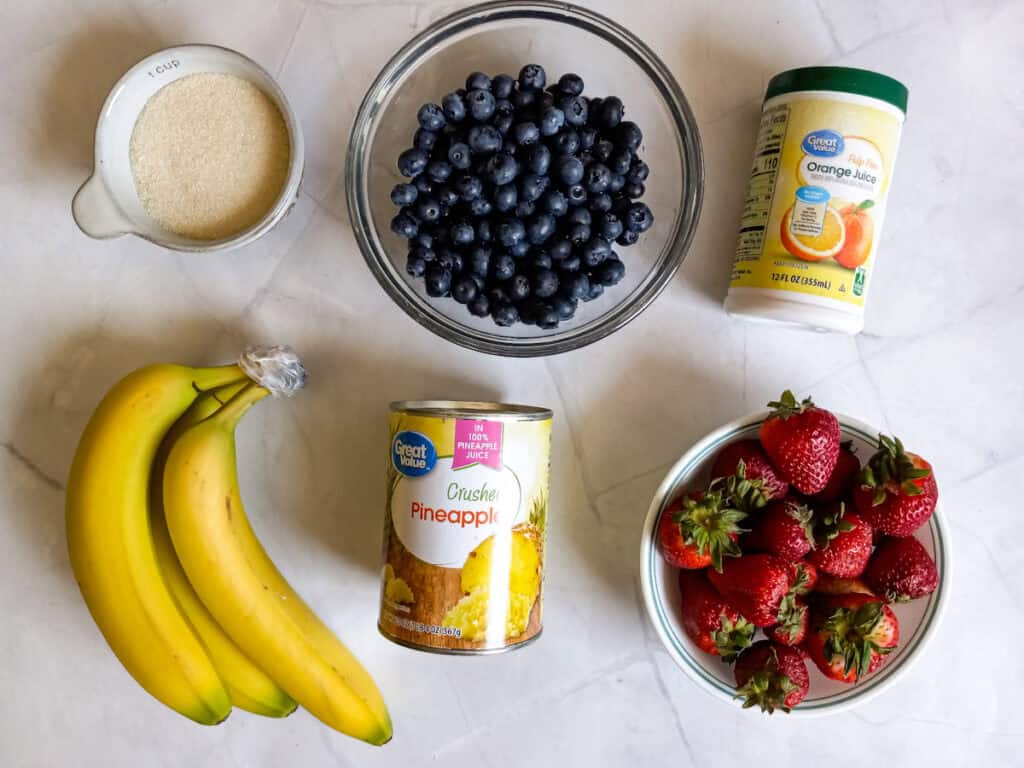 Ingredients: frozen orange juice concentrate, crushed pineapples, bananas, blueberries, and strawberries.