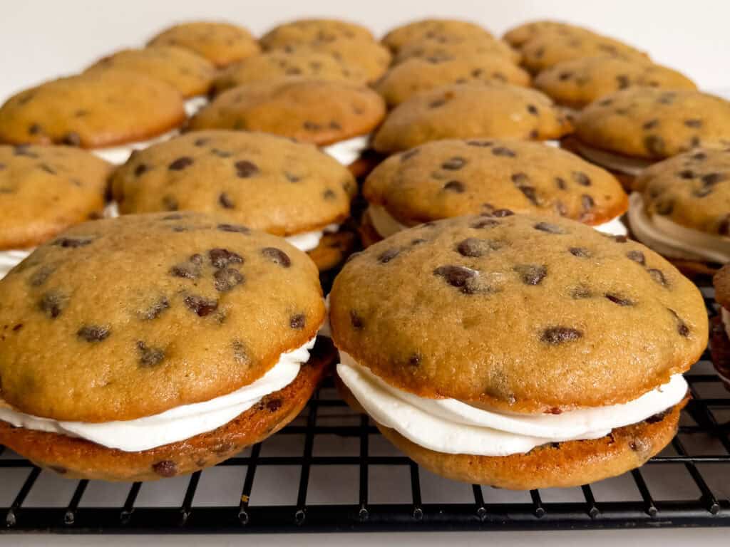 filled whoopie pies on a wire rack.