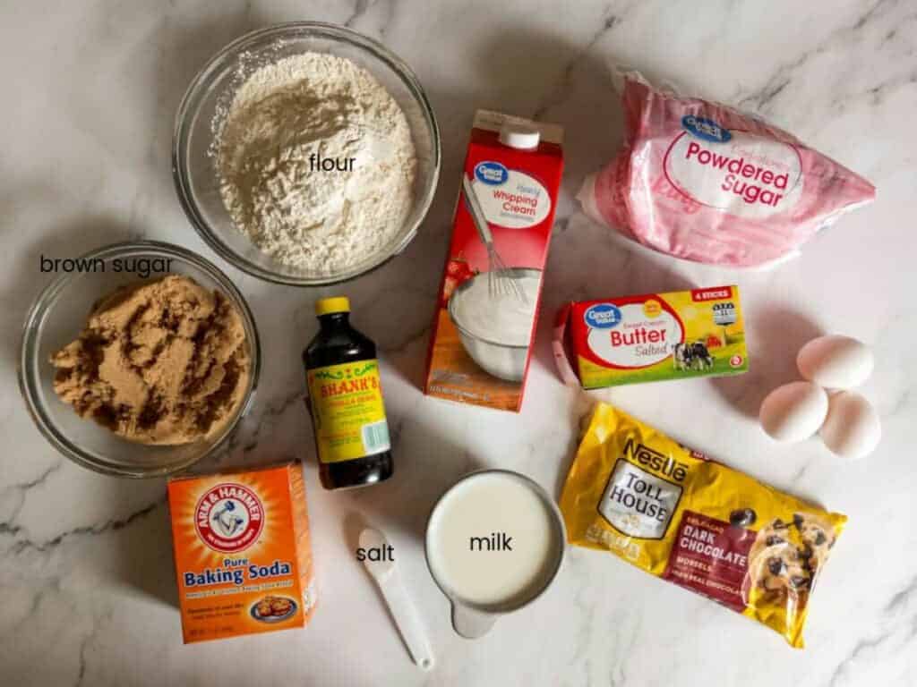 Ingredients: flour, brown sugar, milk, butter, vanilla, eggs, baking soda, salt, chocolate chips, cream, and powdered sugar.