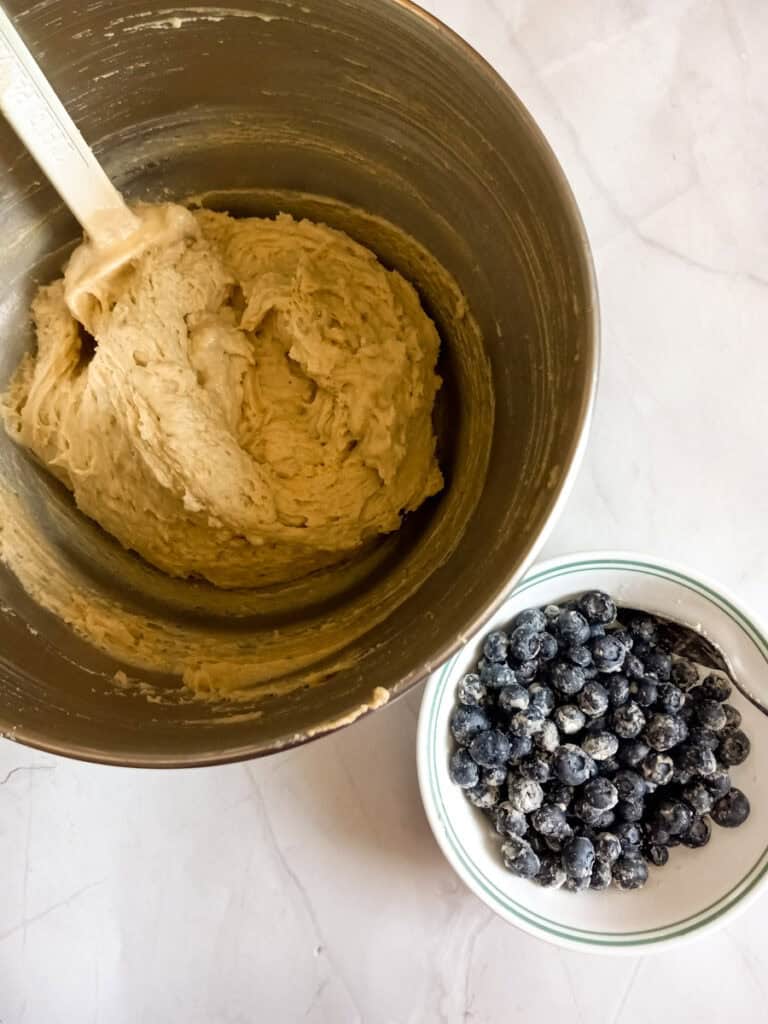 batter in a mixing bowl, blueberries tossed in
flour in a small bowl.