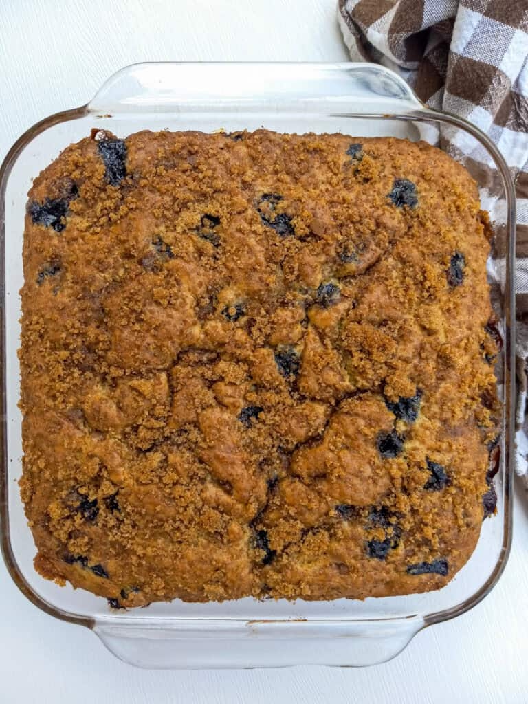 baked blueberry sour cream coffee cake in pan ready for glaze.
