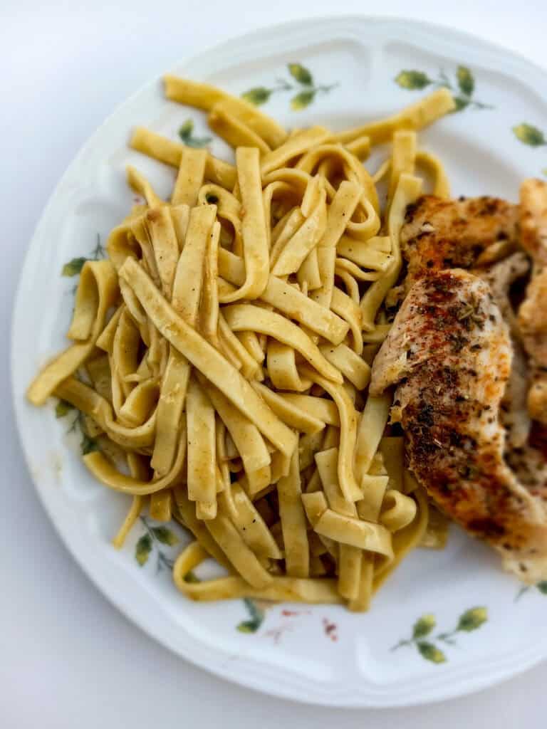 a plate with Amish noodles and chicken .