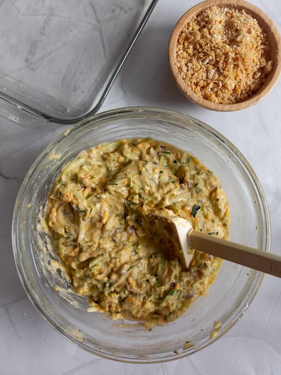 mixing all the ingredients in a large bowl, buttered Ritz cracker crumbs in a small bowl.