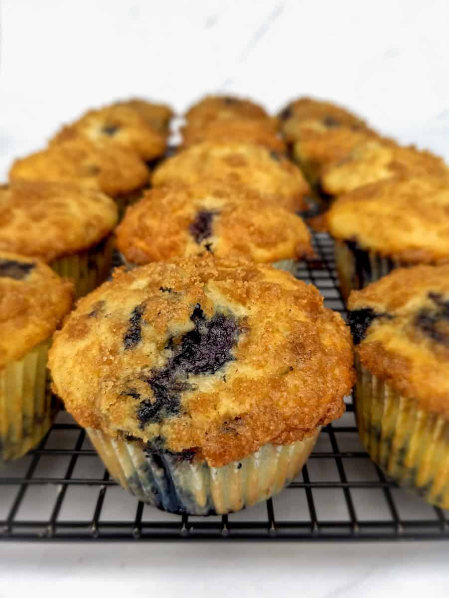 a wire rack full of Amish blueberry muffins.