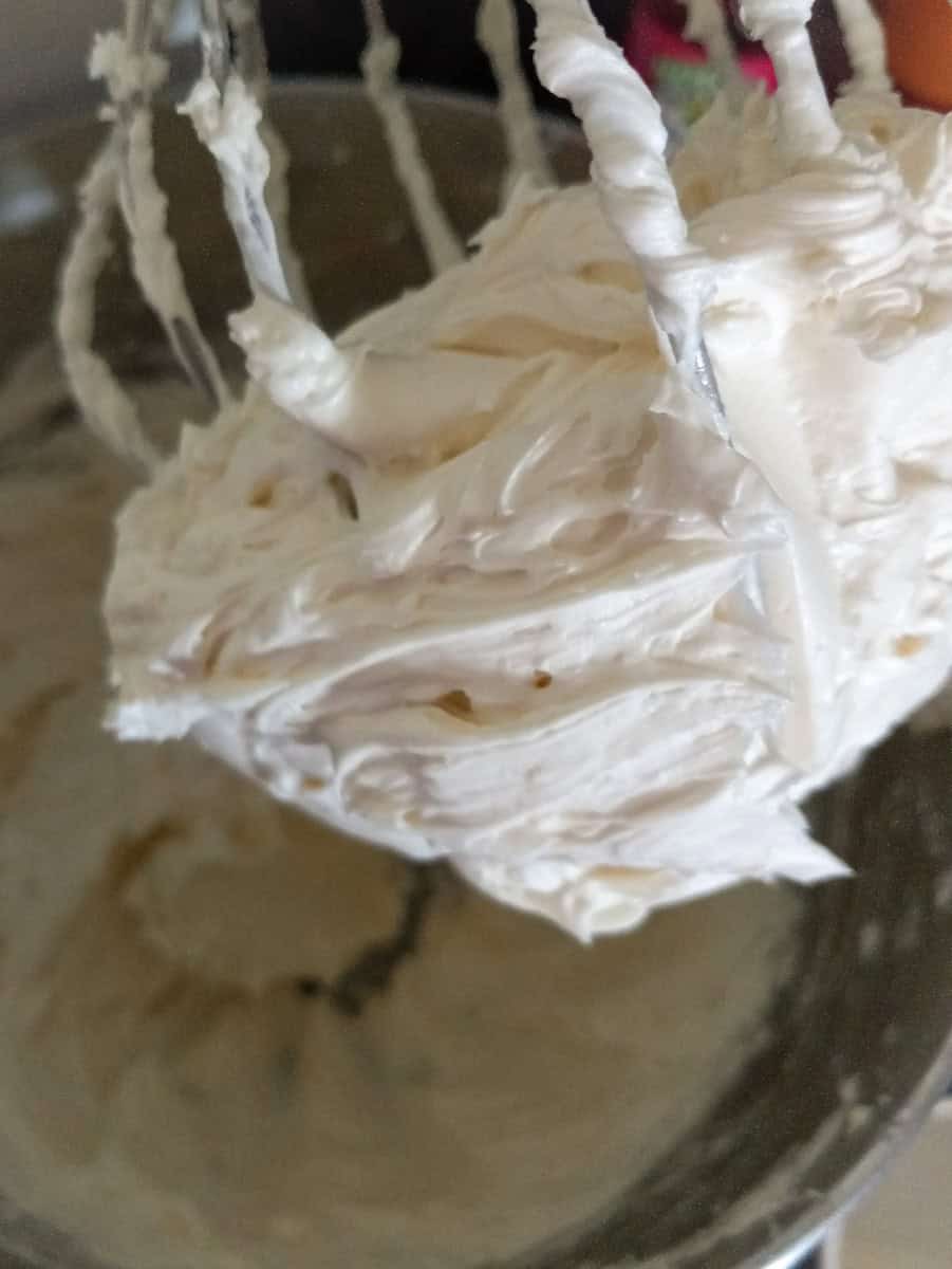 whipped frosting on the whisk.