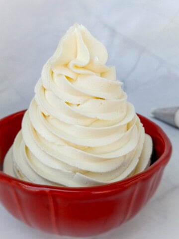 a small bowl of piped buttercream frosting.
