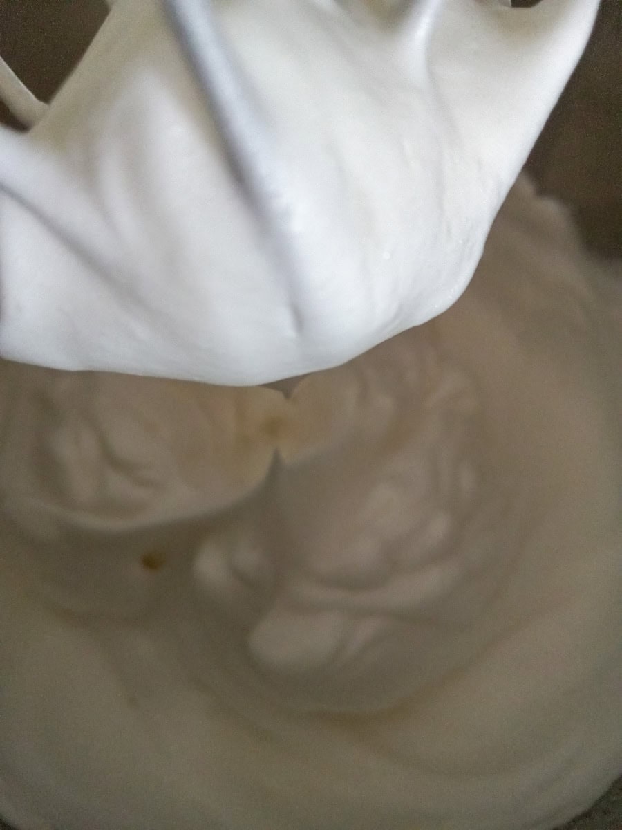 whipped egg whites in a bowl.