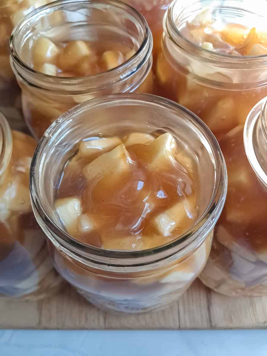 jars filled with apple filling, ready to top with lids.