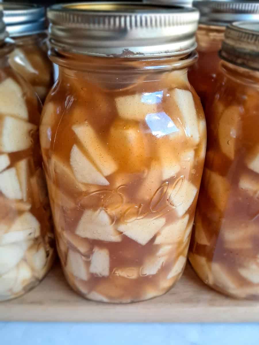 jars of apple pie filling ready to cook.