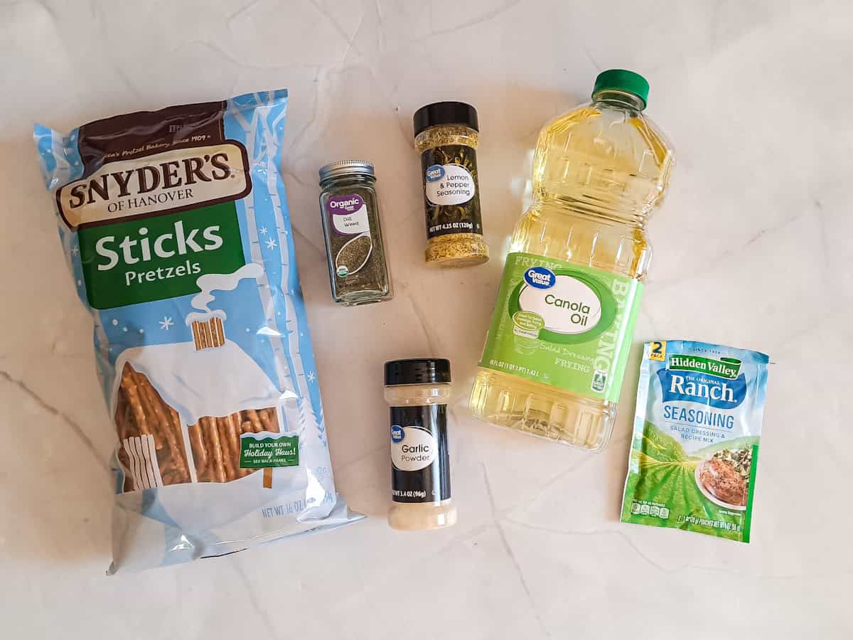 Ingredients: pretzels, oil, ranch, garlic powder, lemon pepper, and dill weed.