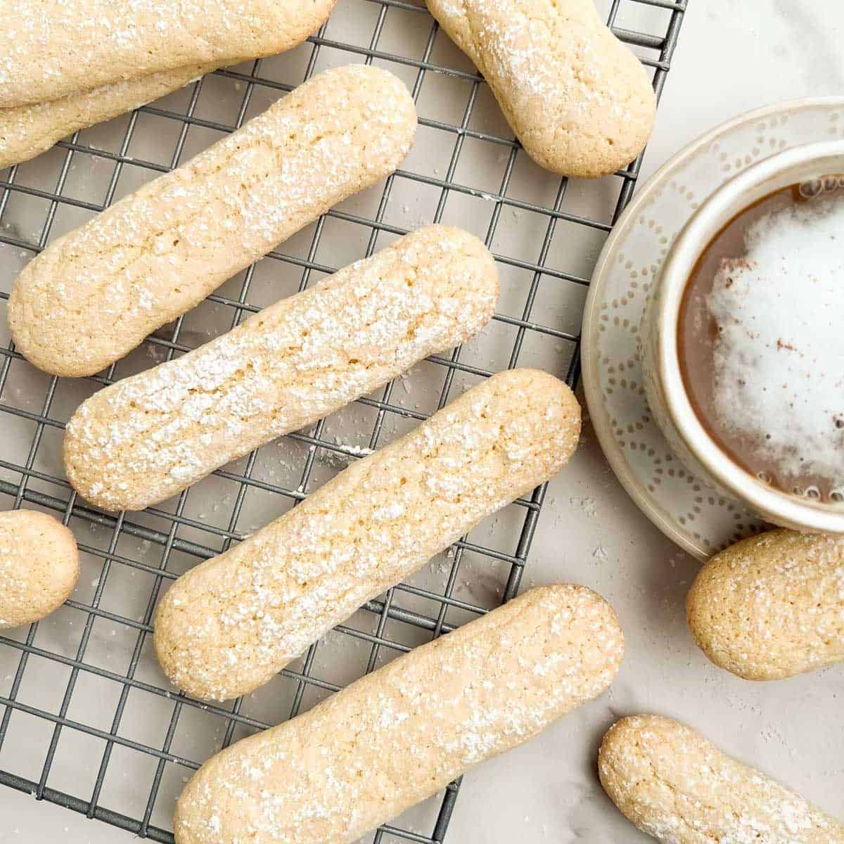 ladyfinger cookies on a wire rack.