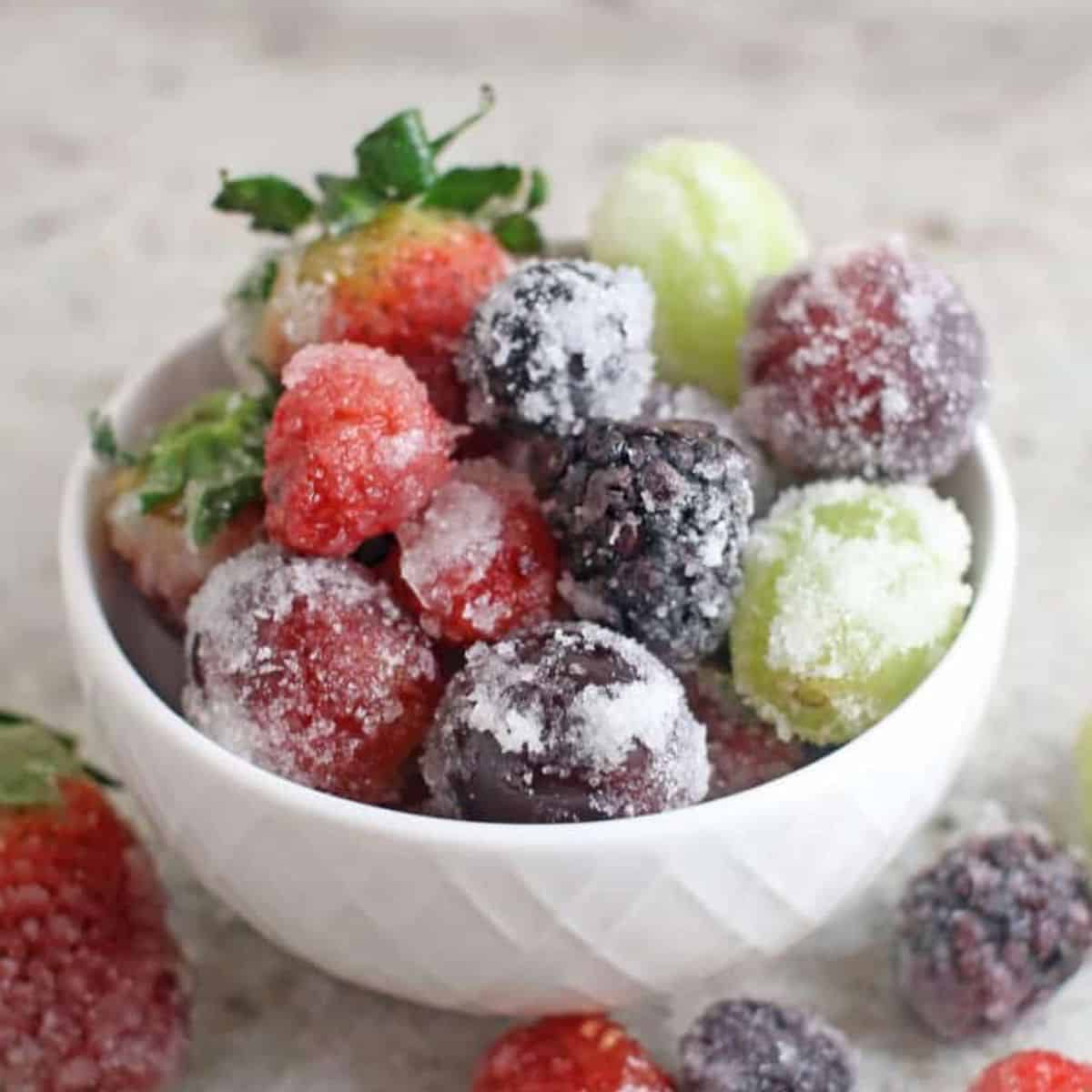 a bowl full of sugared berries.