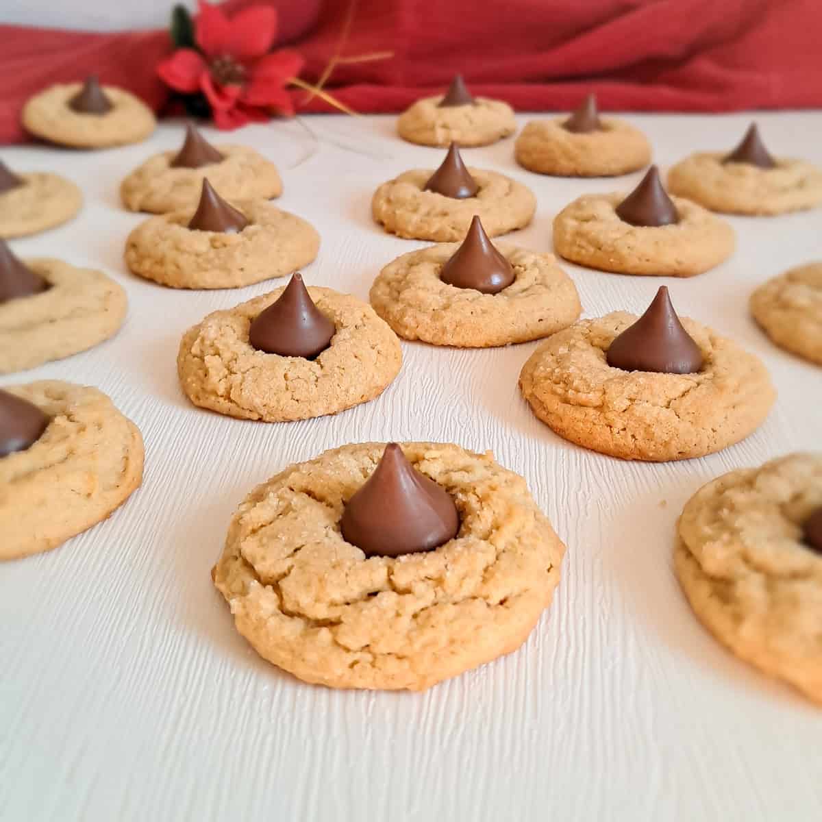peanut butter blossom cookies scattered around.