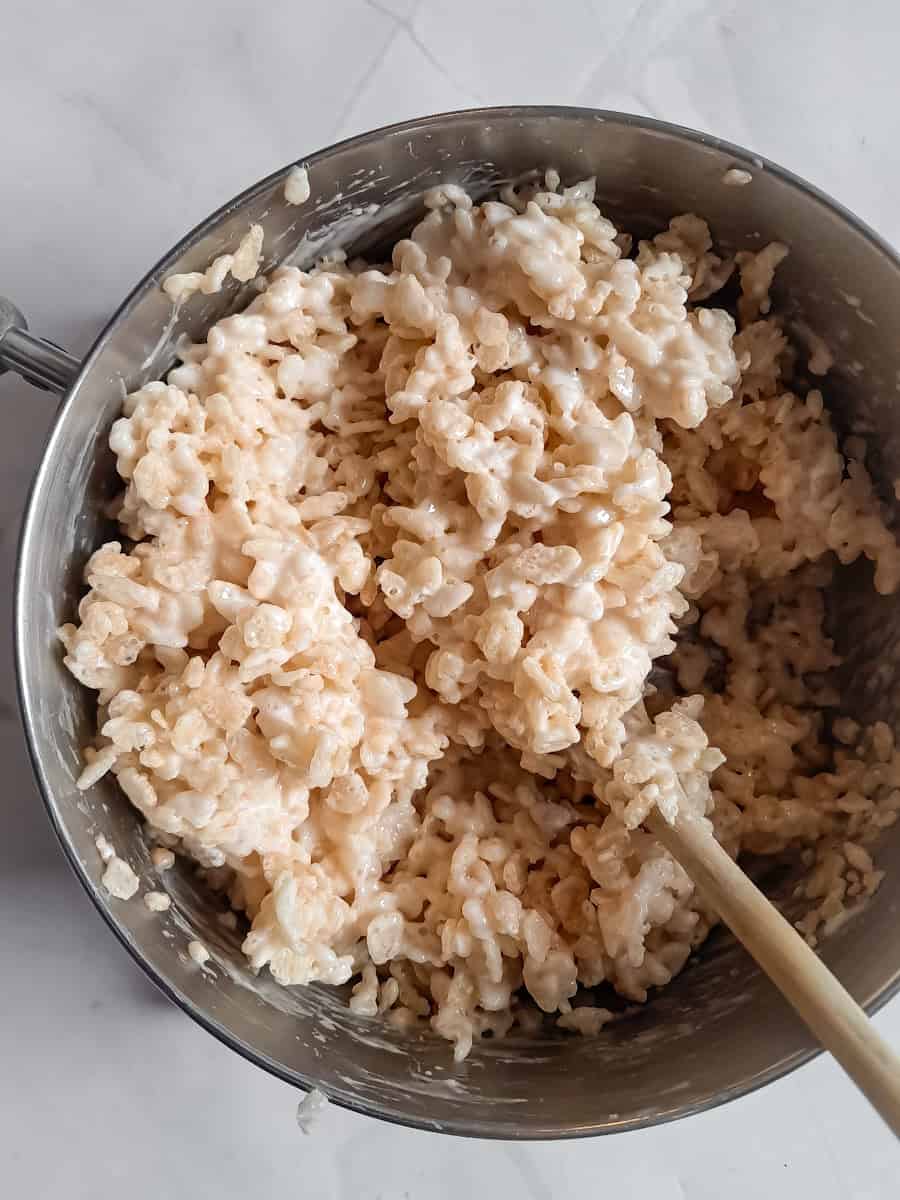 rice krispie marshmallow mixture in saucepan.
