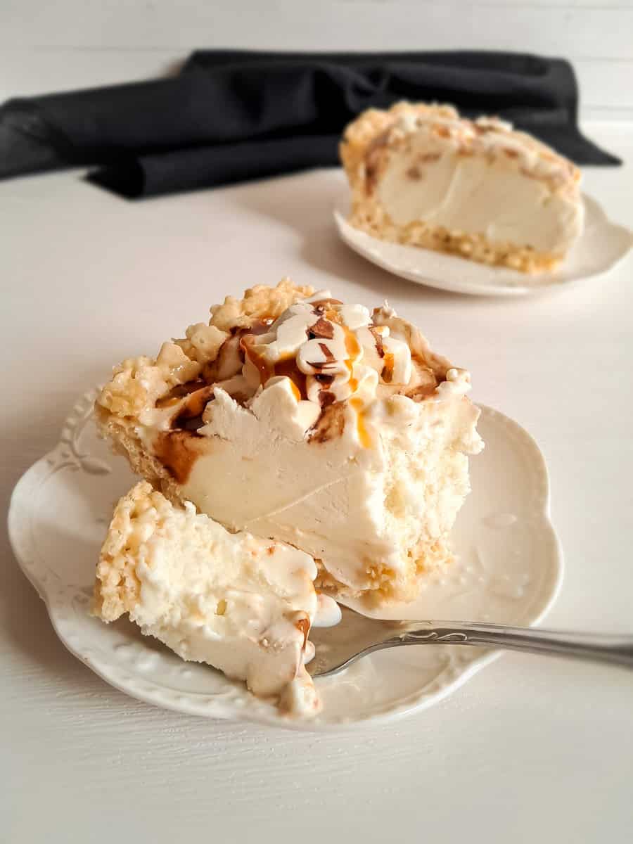 a bite cut out of a slice of ice cream pie.