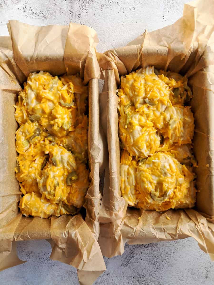 bread balls in pans and ready to rise.