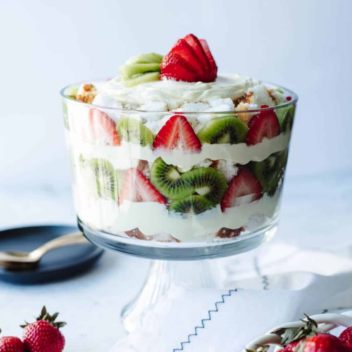 angel food cake trifle with fresh fruit in a glass bowl.