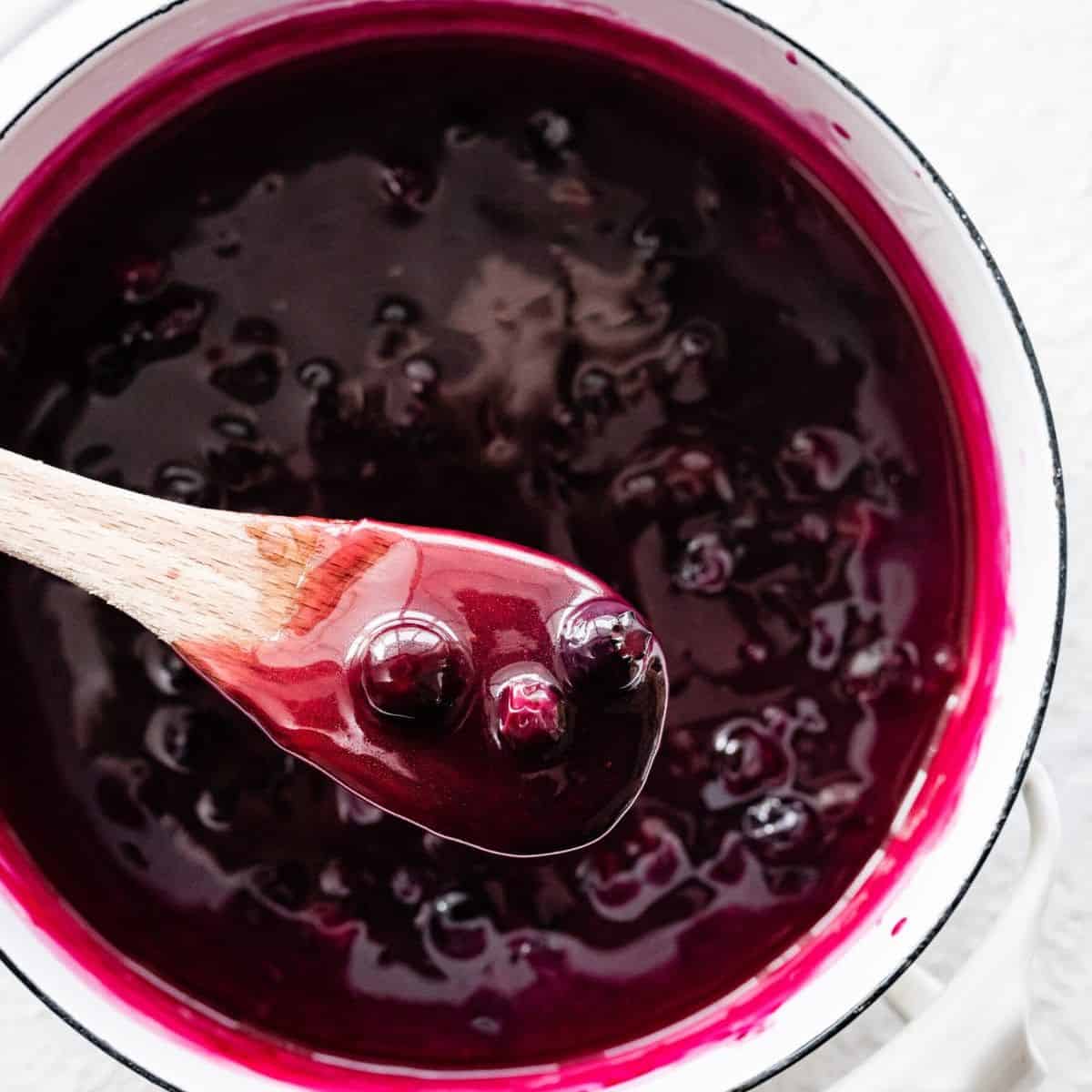 a dish of yummy looking blueberry sauce to serve with angel food cake.
