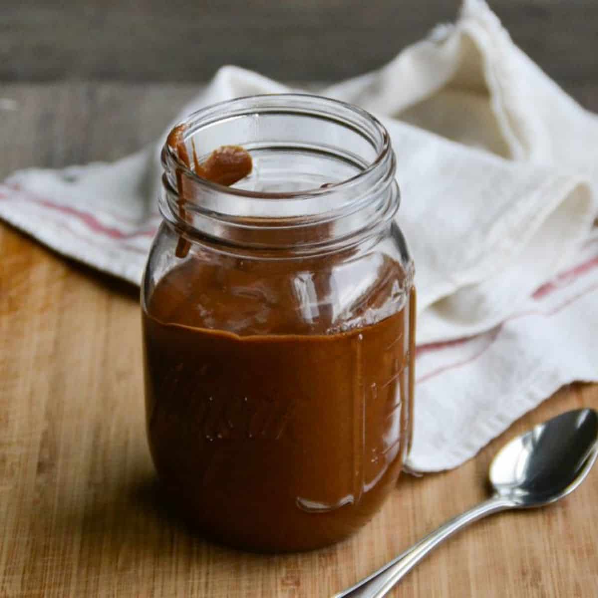 a jar of chocolate caramel sauce.