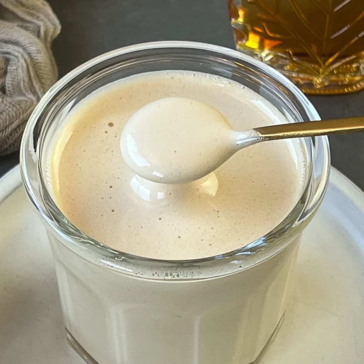 a glass cup of maple cream.