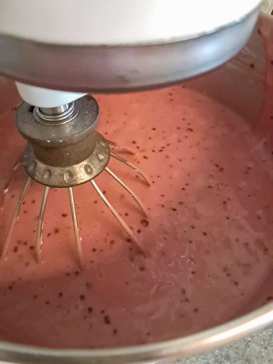 grape tapioca in mixing bowl with whipped cream whipped into it.