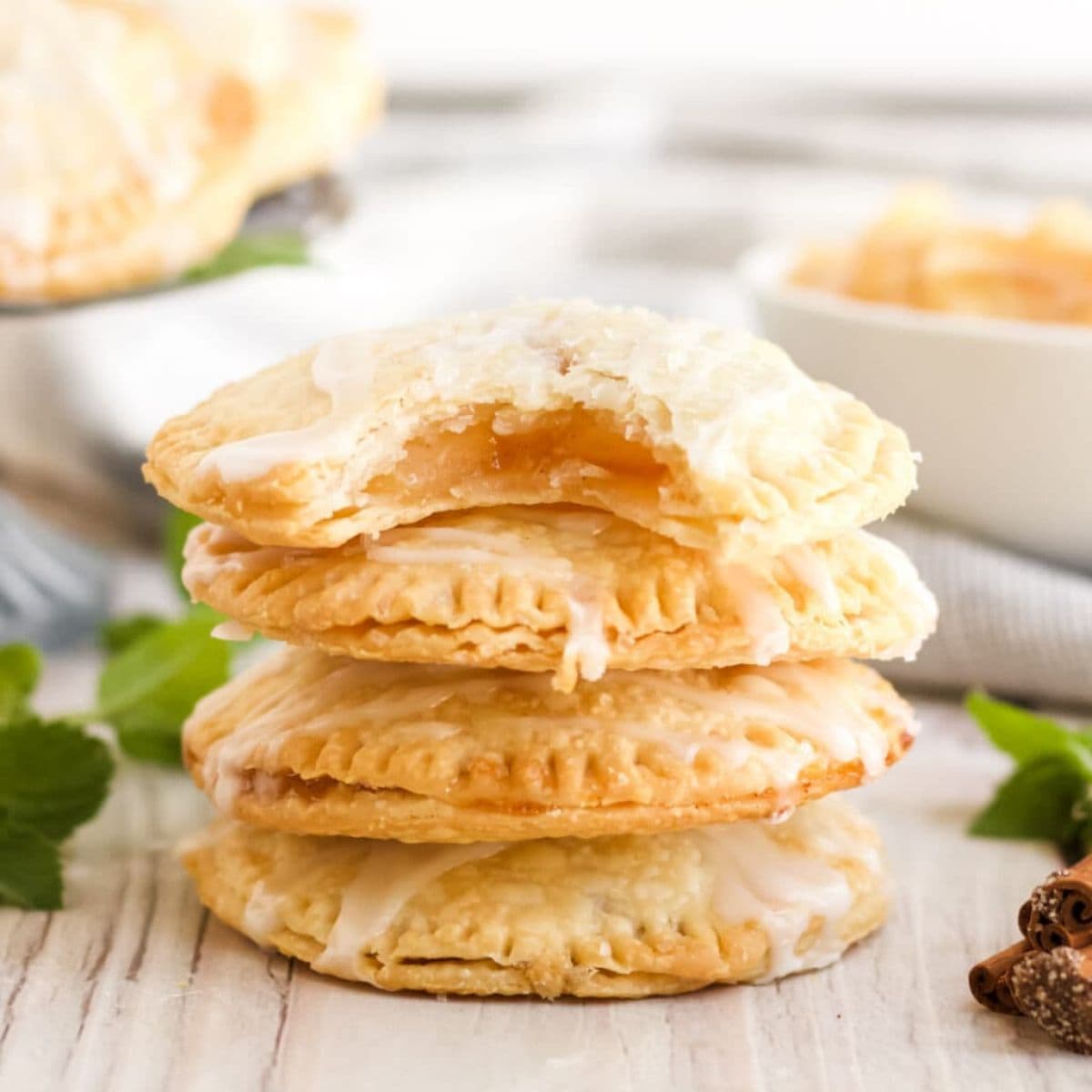 a stack of air fryer apple hand pies.