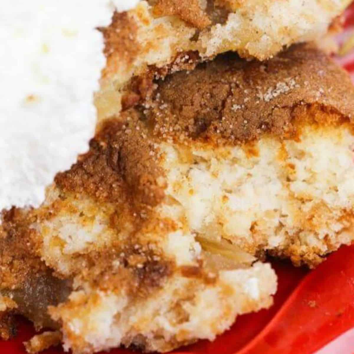 a slaice of apple dump cake on a plate.