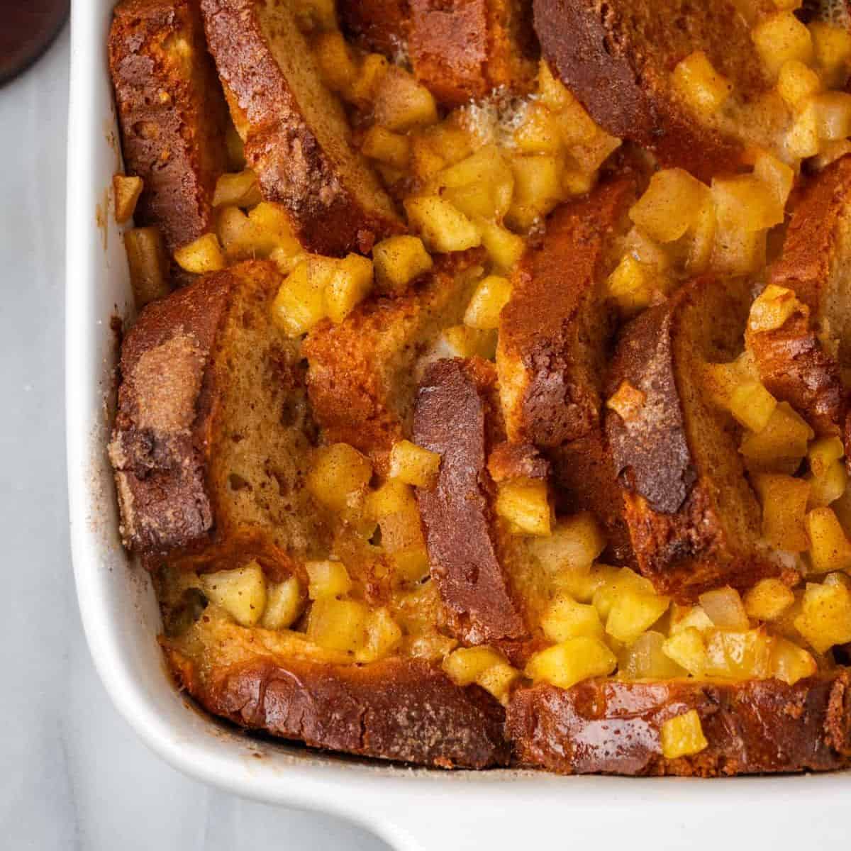 a pan of brioche french toast made with canned apple pie filling.