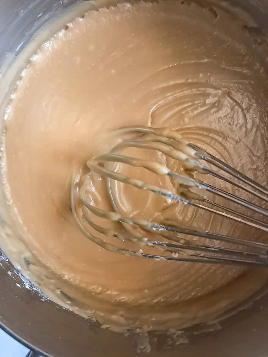 cooking brown sugar, butter, and cream in a saucepan.